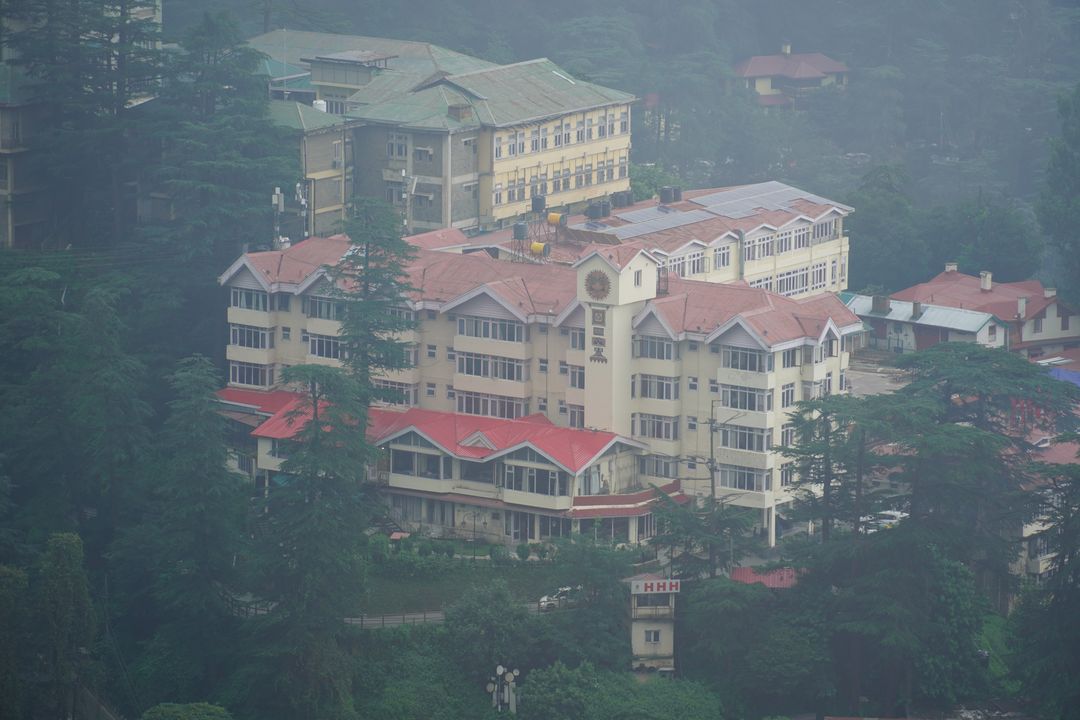 hillside houses in mist